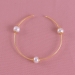 Pearls Bangle Bracelet crafted in alloy and yellow gold polished